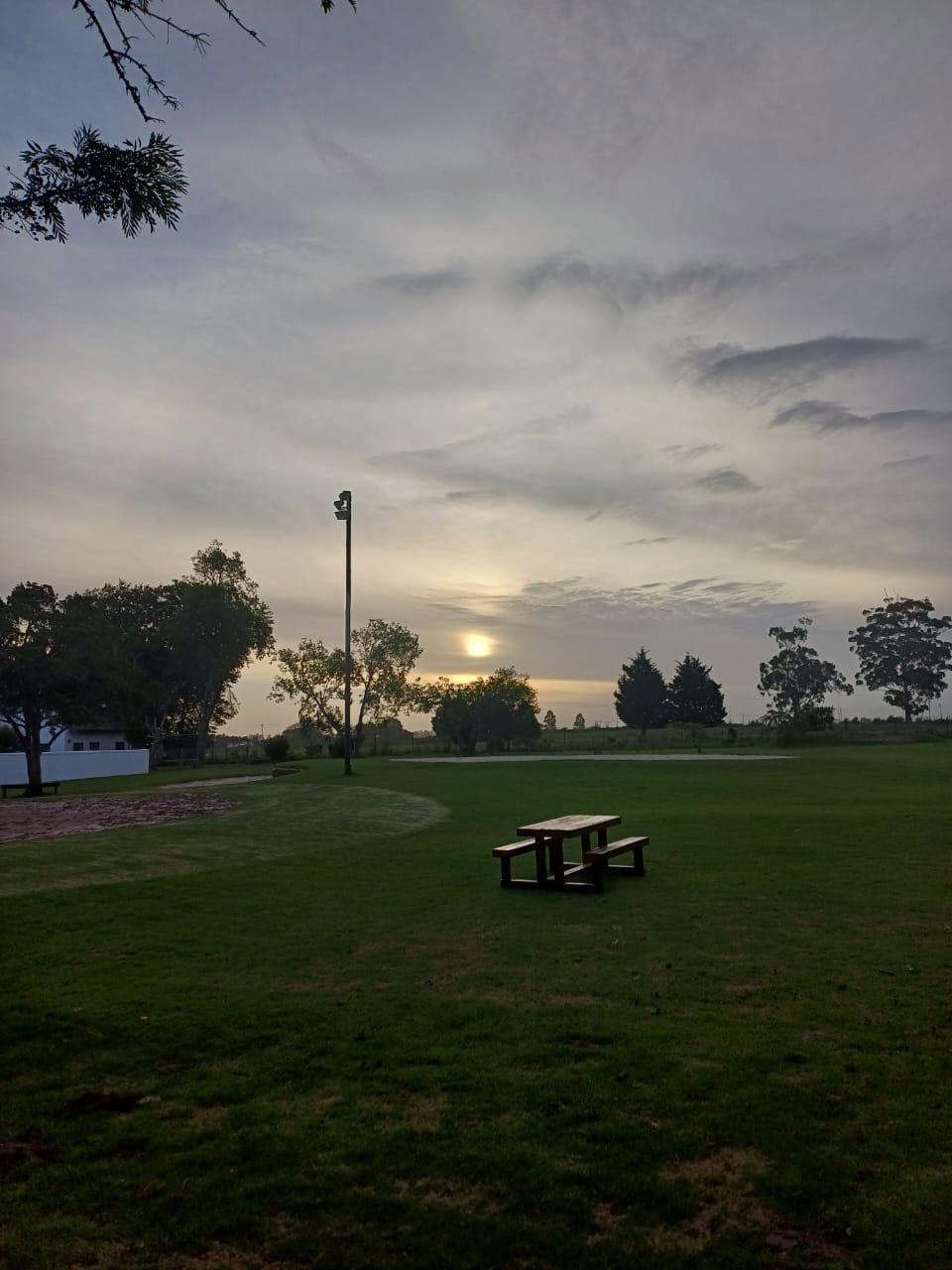 Beautiful campus grounds at sunset with outdoor recreational areas