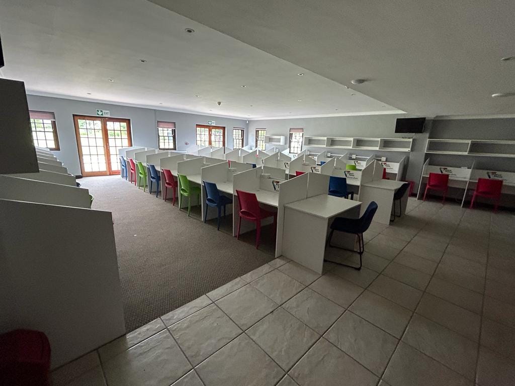 Modern classroom with individual study stations and colorful chairs